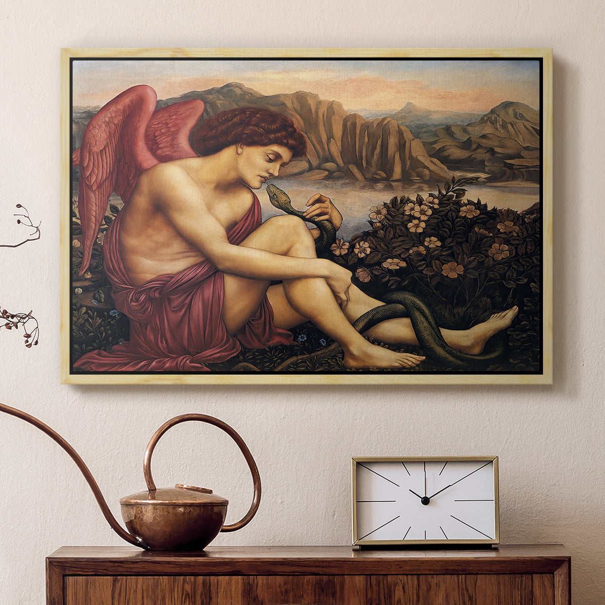 Natural wood floater framed canvas featuring a religious scene with angel defeating snake in dramatic pose, displayed above a cabinet in a soft-toned living room.