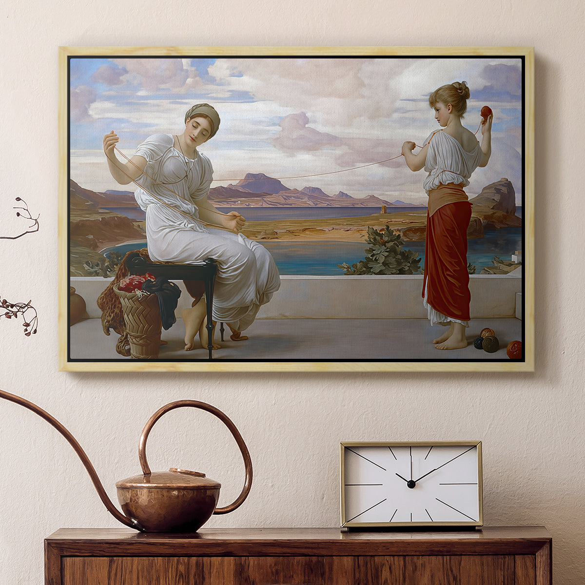 Natural wood floater framed canvas featuring a classical scene of figures winding thread together, displayed above a cabinet in a soft-toned living room.