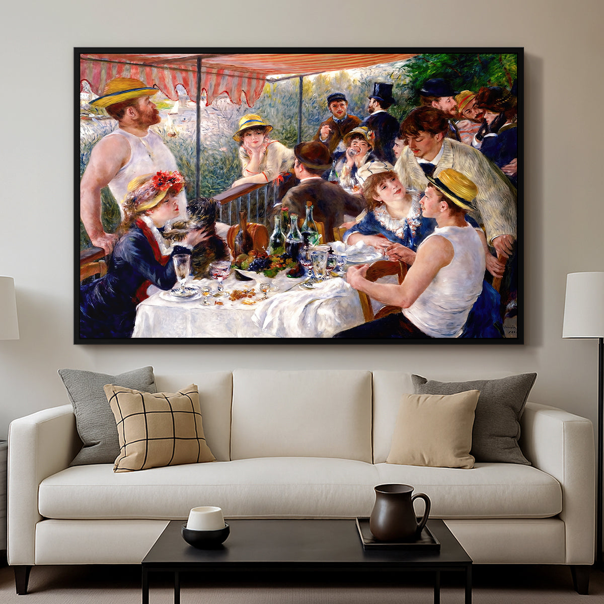 Luncheon of the Boating Party (Le Déjeuner des canotiers), 1880-1881 by Pierre-Auguste Renoir displayed in a black floater framed canvas above a sofa in a clean living room.