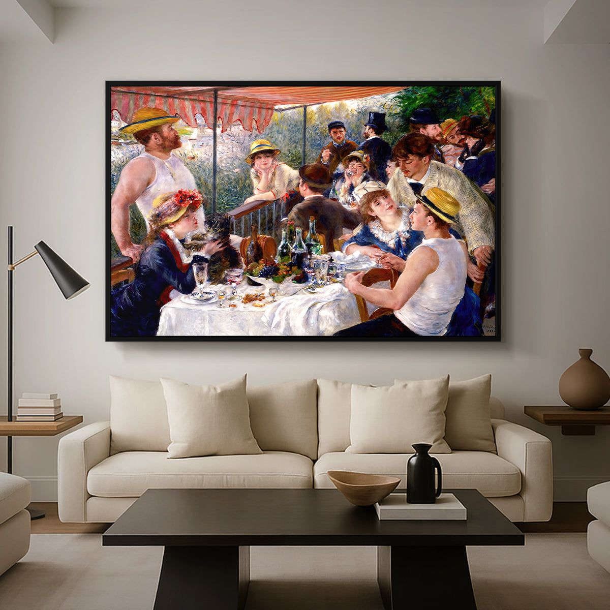Luncheon of the Boating Party (Le Déjeuner des canotiers), 1880-1881 by Pierre-Auguste Renoir as a black floater framed canvas featuring a group of elegantly dressed people dining together on a sunlit balcony overlooking the river, displayed above a sofa in a modern living room.