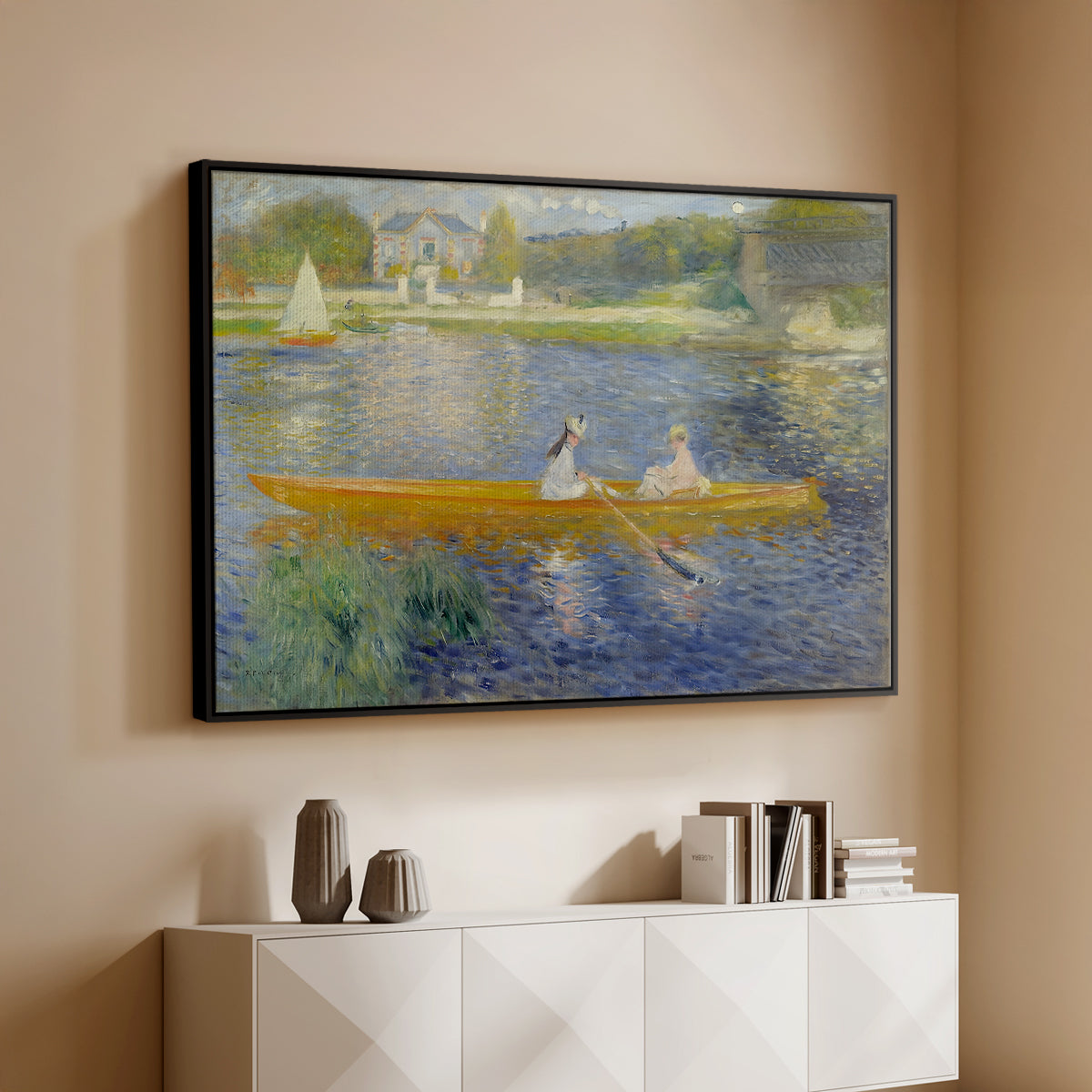 Black floater framed canvas of The Skiff (La Yole), 1875 by Pierre-Auguste Renoir, featuring an impressionist boating scene with people relaxing in a narrow skiff above a console cabinet in a minimalist entryway.