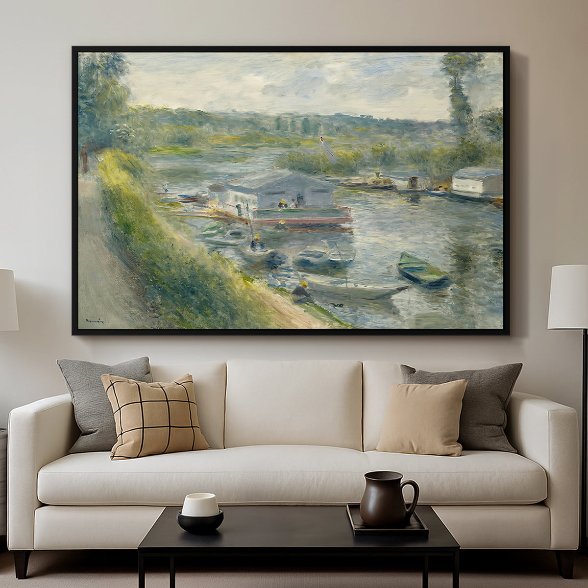 Wash-House Boat at Bas-Meudon, c. 1874 by Pierre-Auguste Renoir displayed in a black floater framed canvas above a sofa in a clean living room.