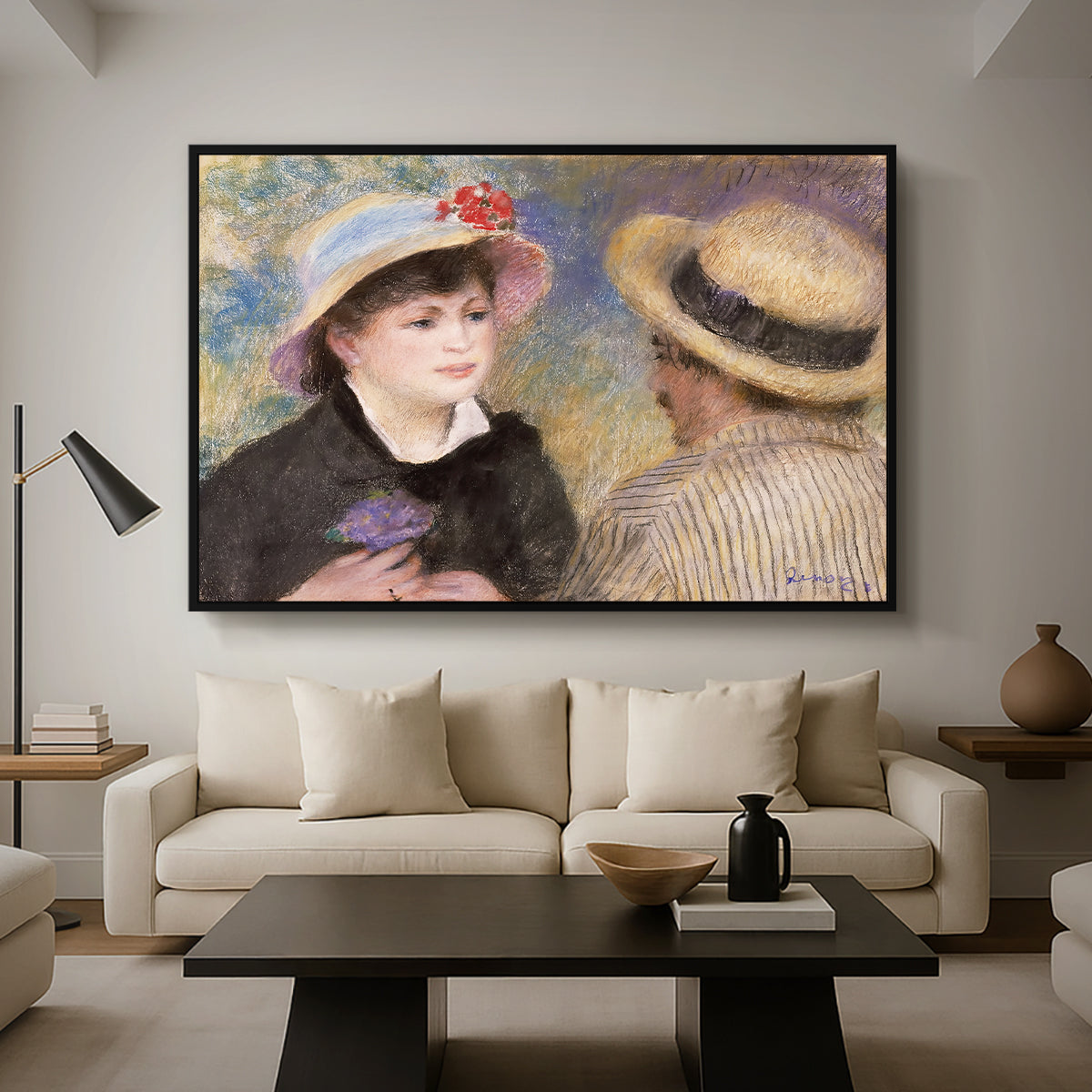 Boating Couple (Aline Charigot and Renoir), c. 1881 by Pierre-Auguste Renoir as a black floater framed canvas featuring a close-up of a couple seated together outdoors with hats and soft sunlight, displayed above a sofa in a modern living room.