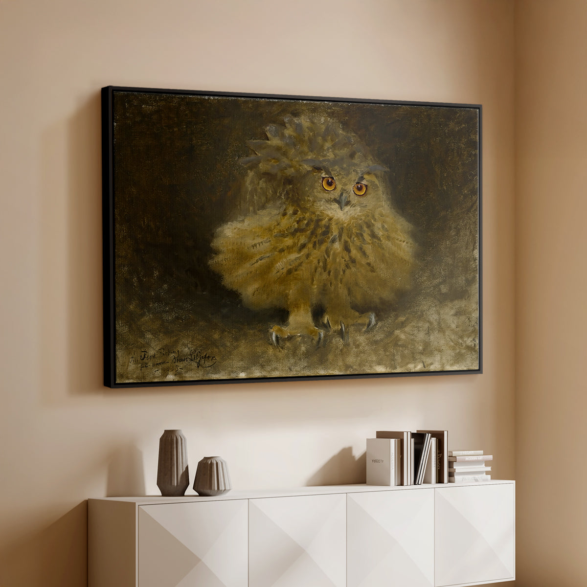 Black floater framed canvas of An Eagle Owl (Berguv), 1905 by Bruno Liljefors, featuring a detailed wildlife painting of eagle owl with piercing eyes in darkness above a console cabinet in a minimalist entryway.