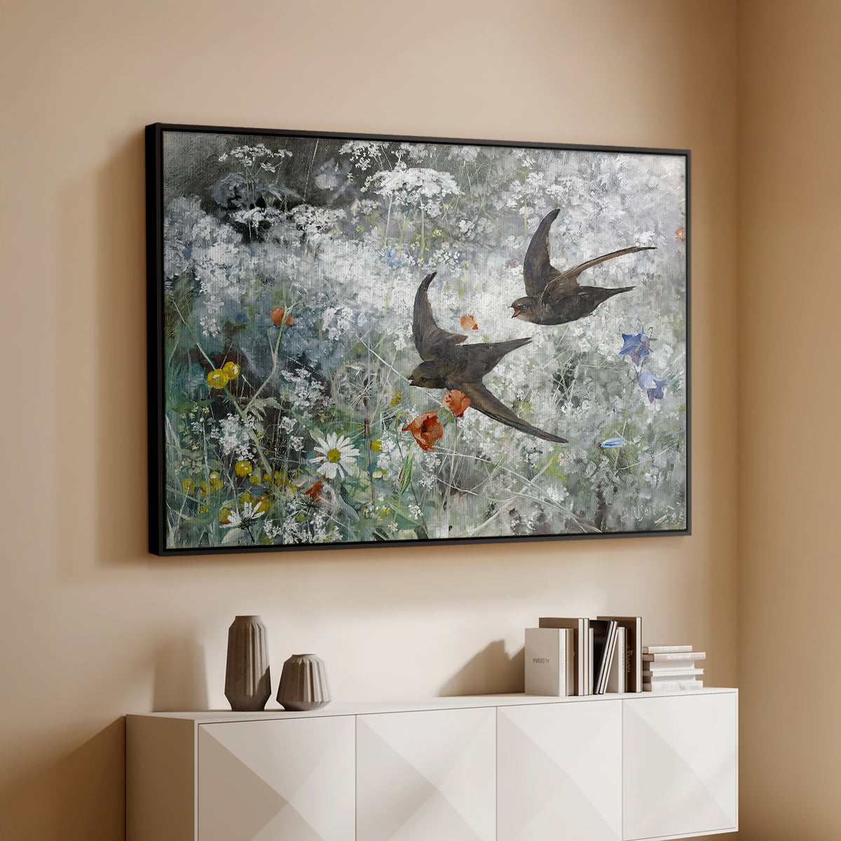 Black floater framed canvas of Common Swifts, 1886 by Bruno Liljefors, featuring swifts gliding midair with wings spread against soft sky above a console cabinet in a minimalist entryway.
