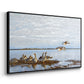 Angled view of Greylag Geese (Grågäss), 1922 by Bruno Liljefors in a black floater framed canvas.