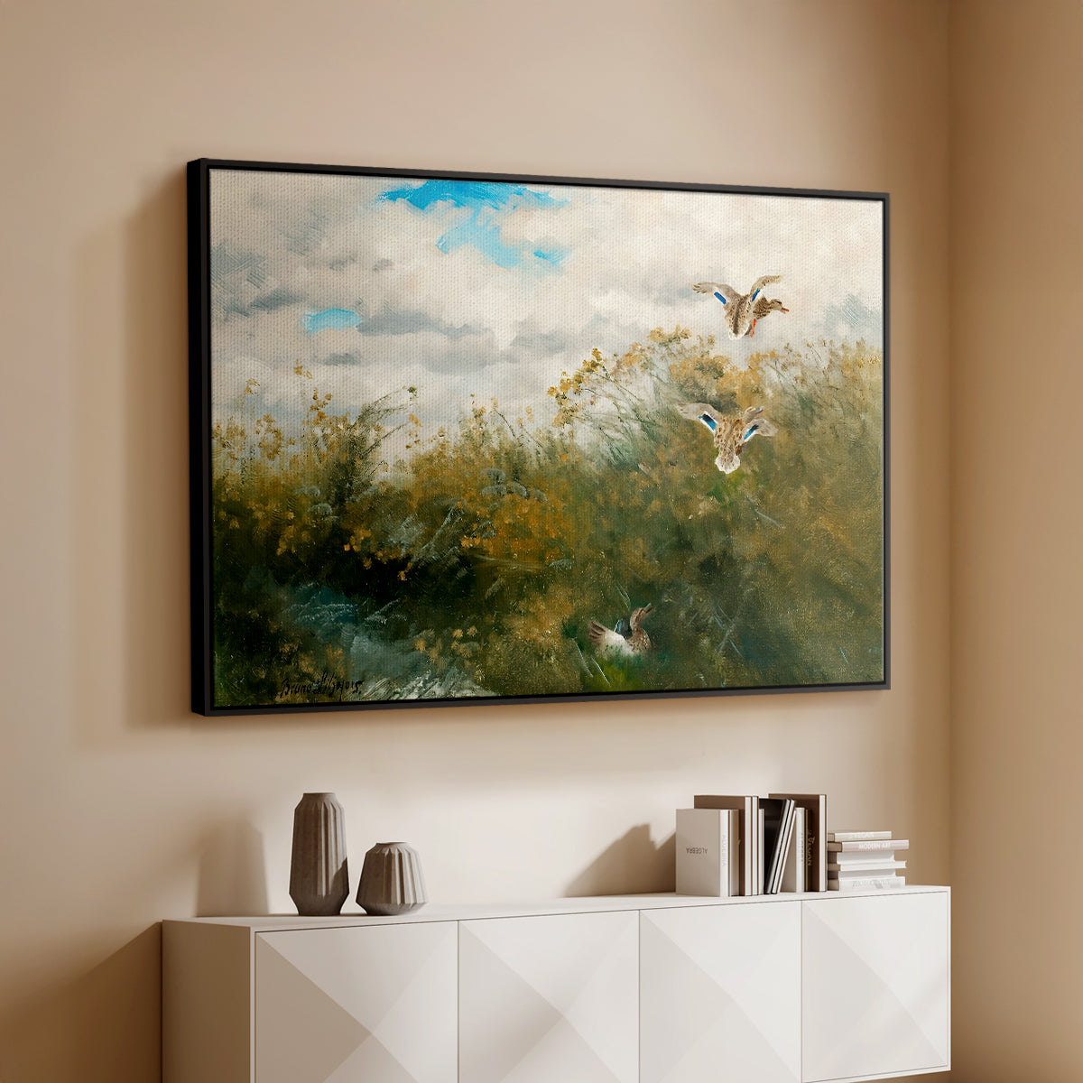 Black floater framed canvas of Wild Ducks (Grasänder), 1890 by Bruno Liljefors, featuring a wildlife scene of ducks walking through tall grass beside water above a console cabinet in a minimalist entryway.
