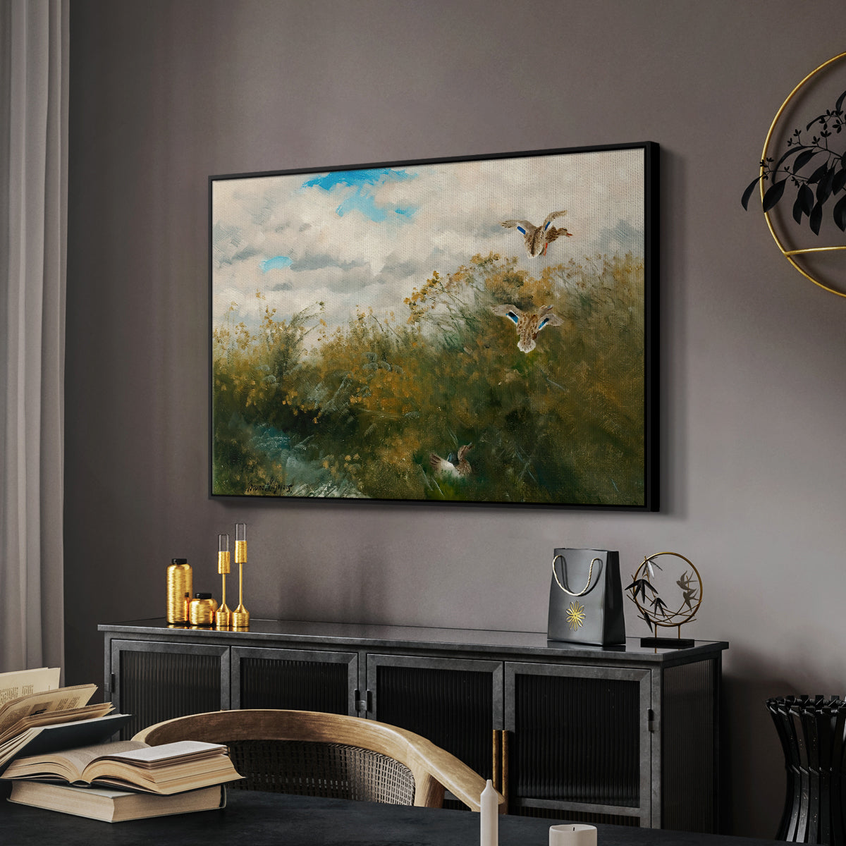 Wild Ducks (Grasänder), 1890 by Bruno Liljefors in a black floater framed canvas featuring a group of ducks foraging in natural marsh setting, displayed above a desk in a dark home office interior.
