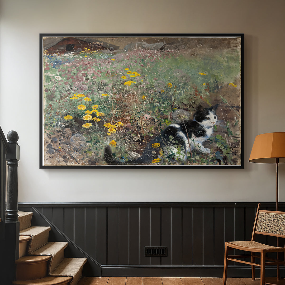 Black floater framed canvas featuring a naturalistic depiction of cat in blooming countryside setting, displayed in a hallway near a staircase.