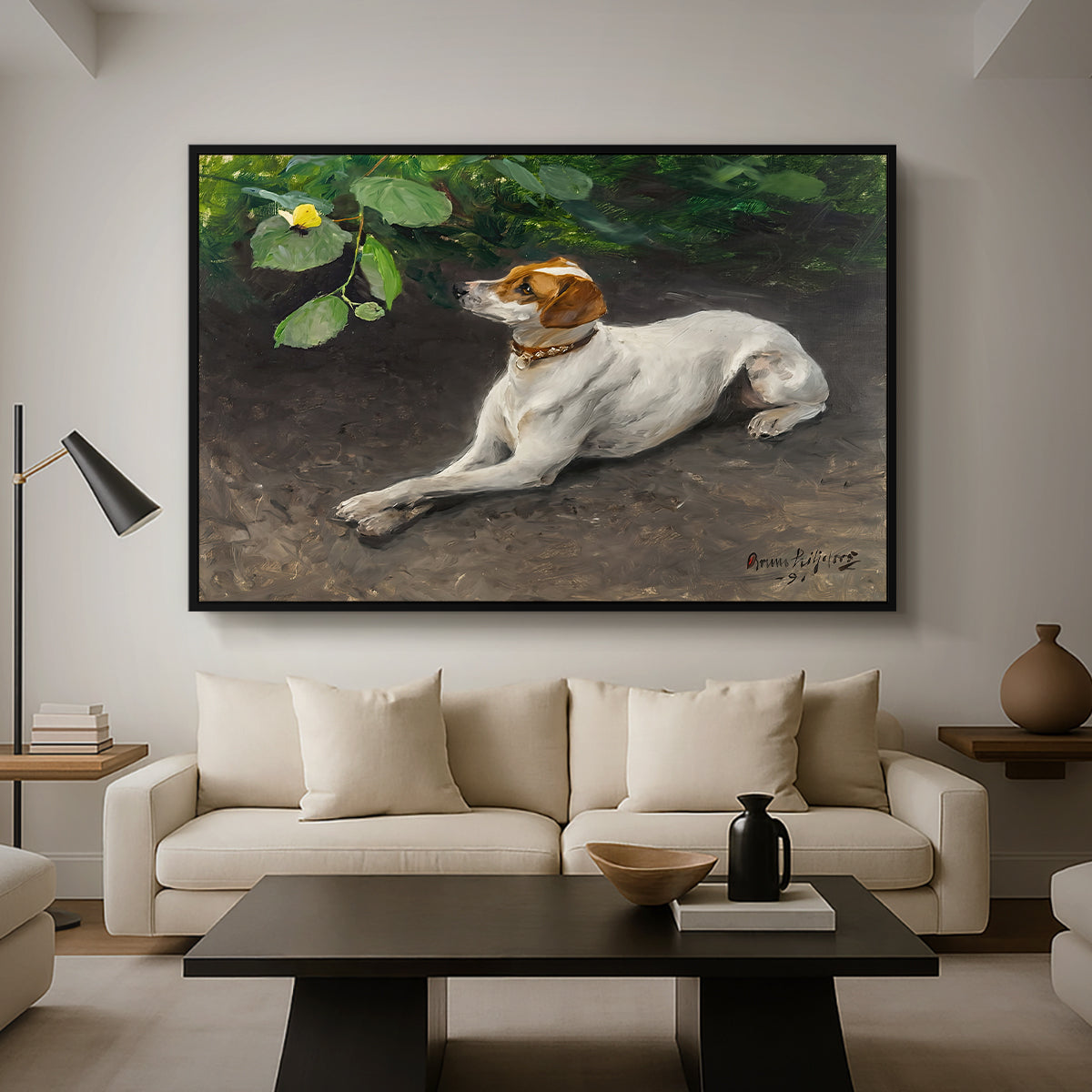 Portrait of a Dog, 1891 by Bruno Liljefors as a black floater framed canvas featuring a dog lying on ground with head raised in natural outdoor setting, displayed above a sofa in a modern living room.