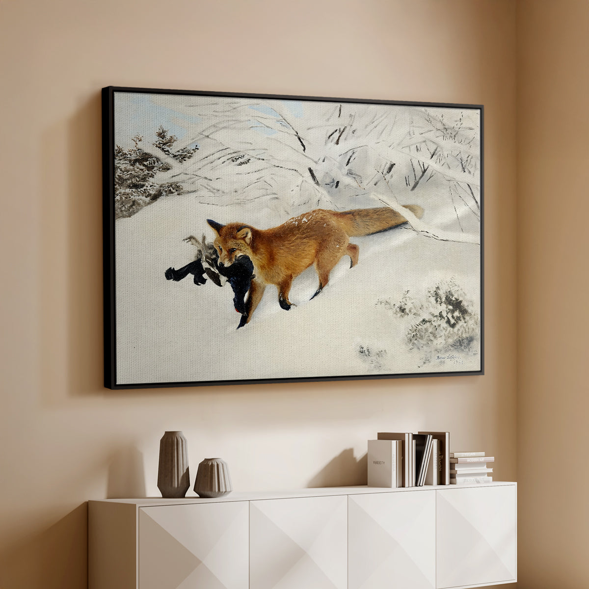 Black floater framed canvas of Fox in Snow Landscape, 1900 by Bruno Liljefors, featuring a wildlife scene of fox moving swiftly through winter terrain above a console cabinet in a minimalist entryway.