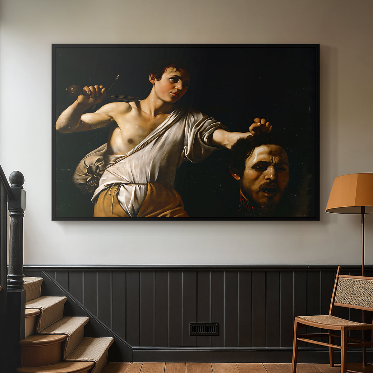 Black floater framed canvas featuring an intense religious scene with figure emerging from darkness holding trophy, displayed in a hallway near a staircase.