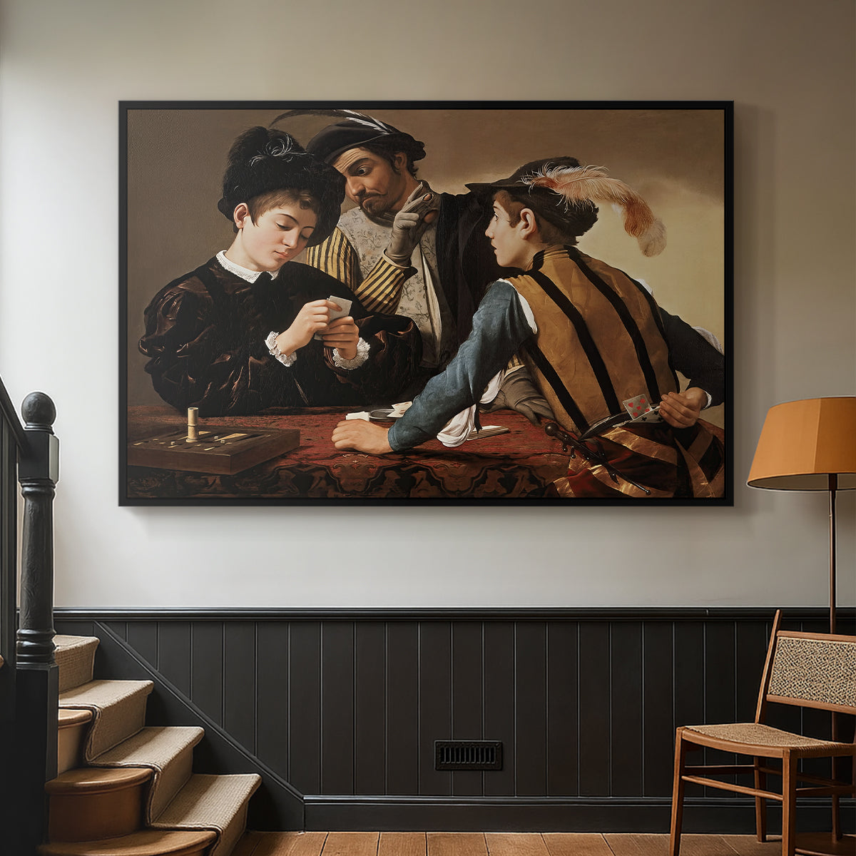 Black floater framed canvas featuring a dramatic interior scene of gambling and trickery among figures, displayed in a hallway near a staircase.
