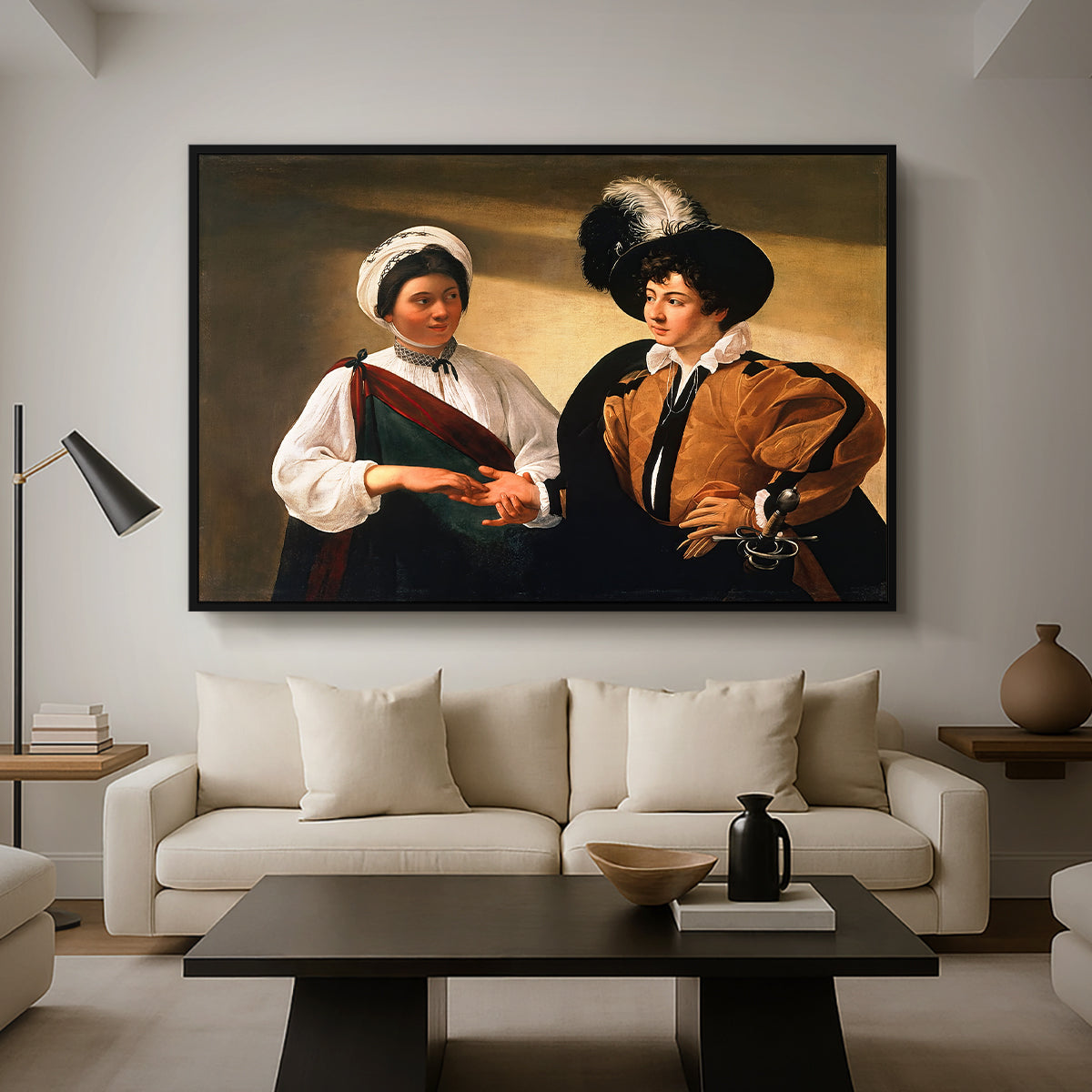 The Fortune Teller (Louvre Version), c. 1595 by Caravaggio as a black floater framed canvas featuring a woman reading a young man's palm while secretly stealing his ring, displayed above a sofa in a modern living room.