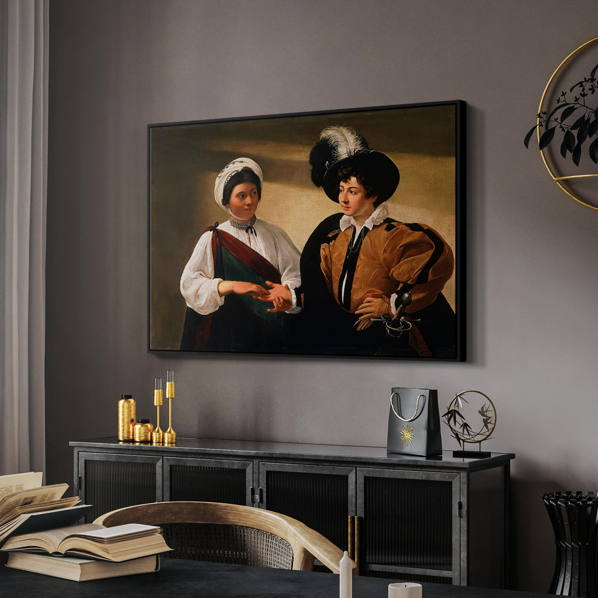 The Fortune Teller (Louvre Version), c. 1595 by Caravaggio in a black floater framed canvas featuring an intimate scene of palm reading with subtle act of theft, displayed above a desk in a dark home office interior.