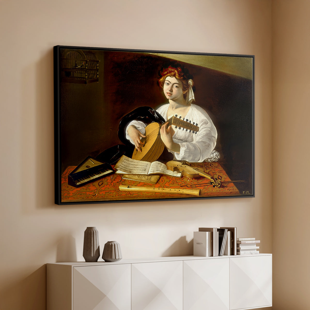 Black floater framed canvas of The Lute Player (Wildenstein Version), c. 1596 by Caravaggio, featuring a musician seated with lute and musical instruments on table above a console cabinet in a minimalist entryway.