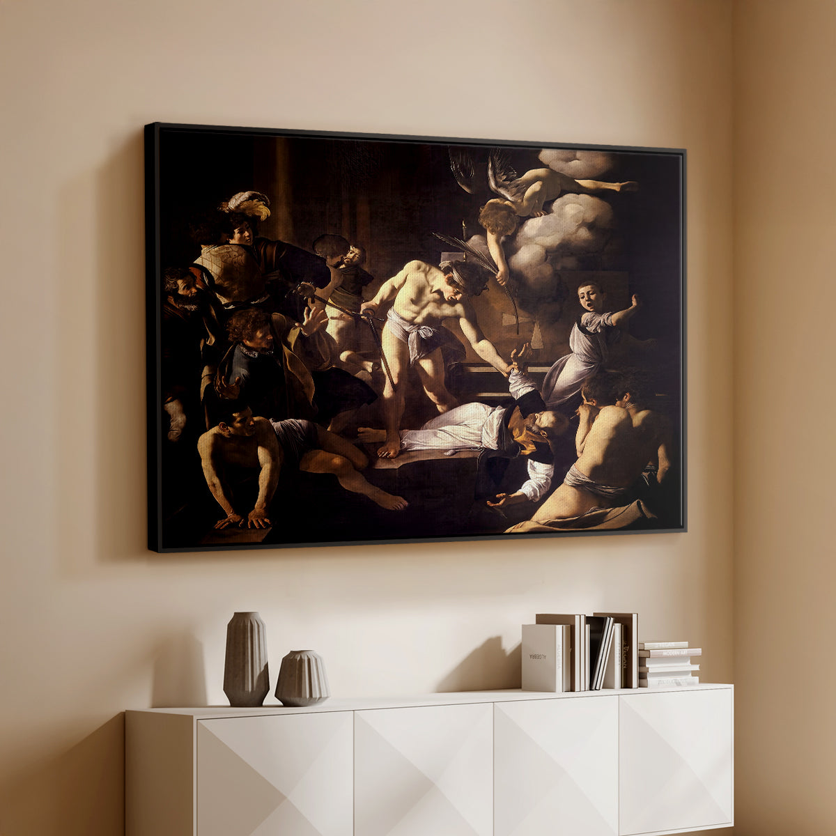 Black floater framed canvas of The Martyrdom of Saint Matthew, 1599-1600 by Caravaggio, featuring a dramatic moment of martyrdom with figures reacting in panic above a console cabinet in a minimalist entryway.