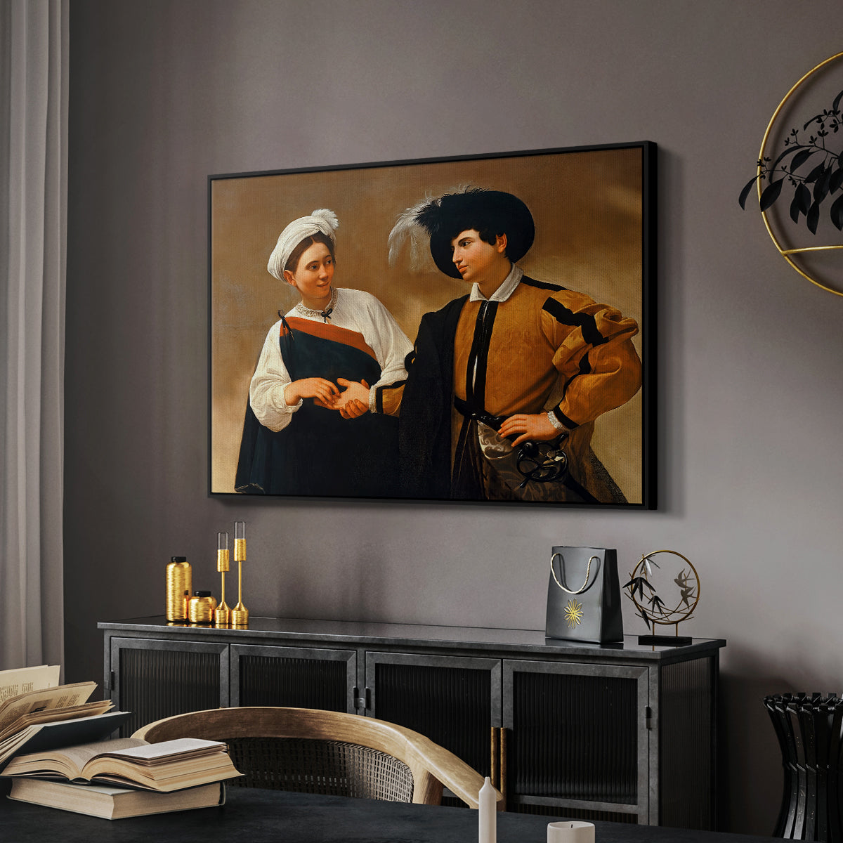 The Fortune Teller (Capitoline Version), c. 1599 by Caravaggio in a black floater framed canvas featuring a close interaction between two figures involving deception and gesture, displayed above a desk in a dark home office interior.