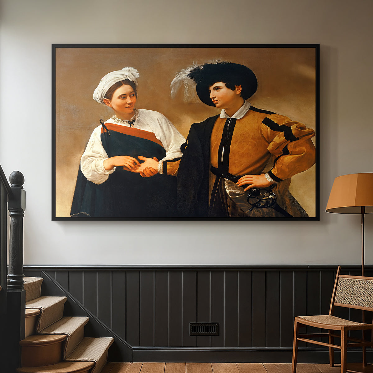 Black floater framed canvas featuring a genre scene of fortune telling with subtle theft, displayed in a hallway near a staircase.