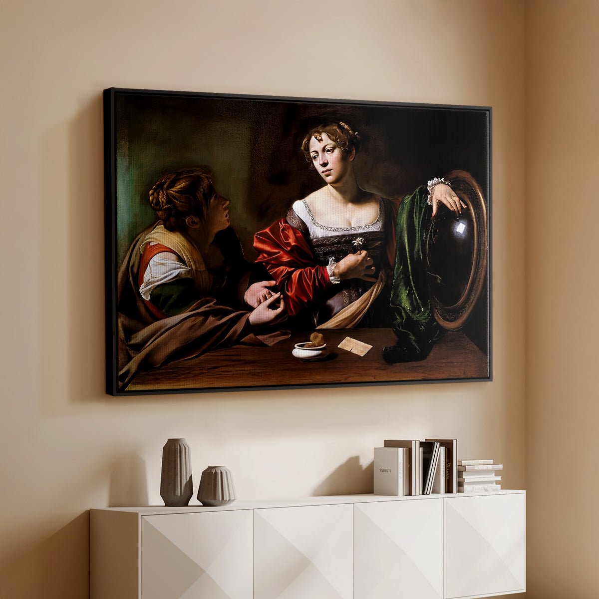 Black floater framed canvas of Martha and Mary Magdalene, c. 1598 by Caravaggio, featuring a biblical scene of Martha speaking to Mary Magdalene indoors above a console cabinet in a minimalist entryway.