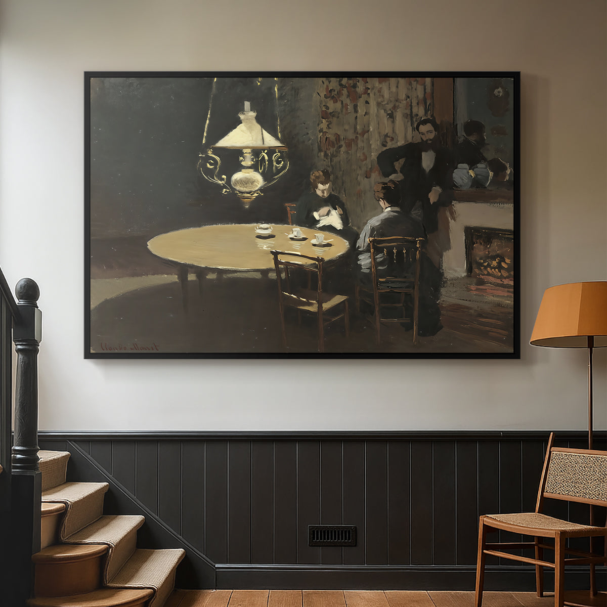 Black floater framed canvas featuring an intimate indoor scene with figure and table in low lighting, displayed in a hallway near a staircase.