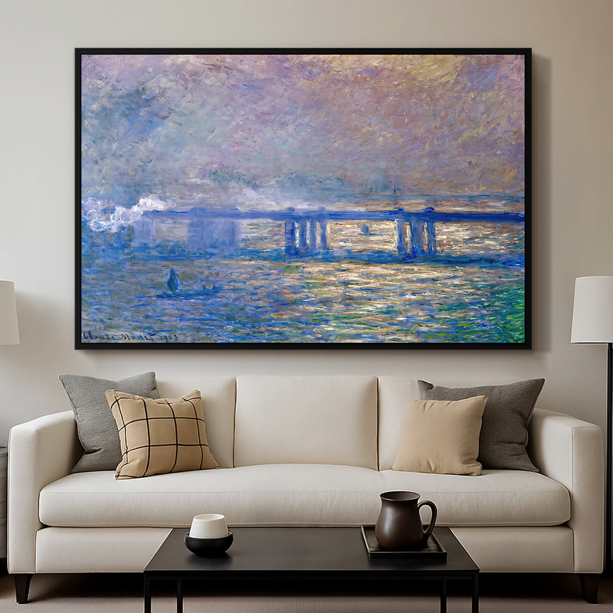 Charing Cross Bridge, 1903 by Claude Monet displayed in a black floater framed canvas above a sofa in a clean living room.
