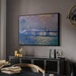 Charing Cross Bridge, 1903 by Claude Monet in a black floater framed canvas featuring an atmospheric depiction of London bridge with reflections in water, displayed above a desk in a dark home office interior.