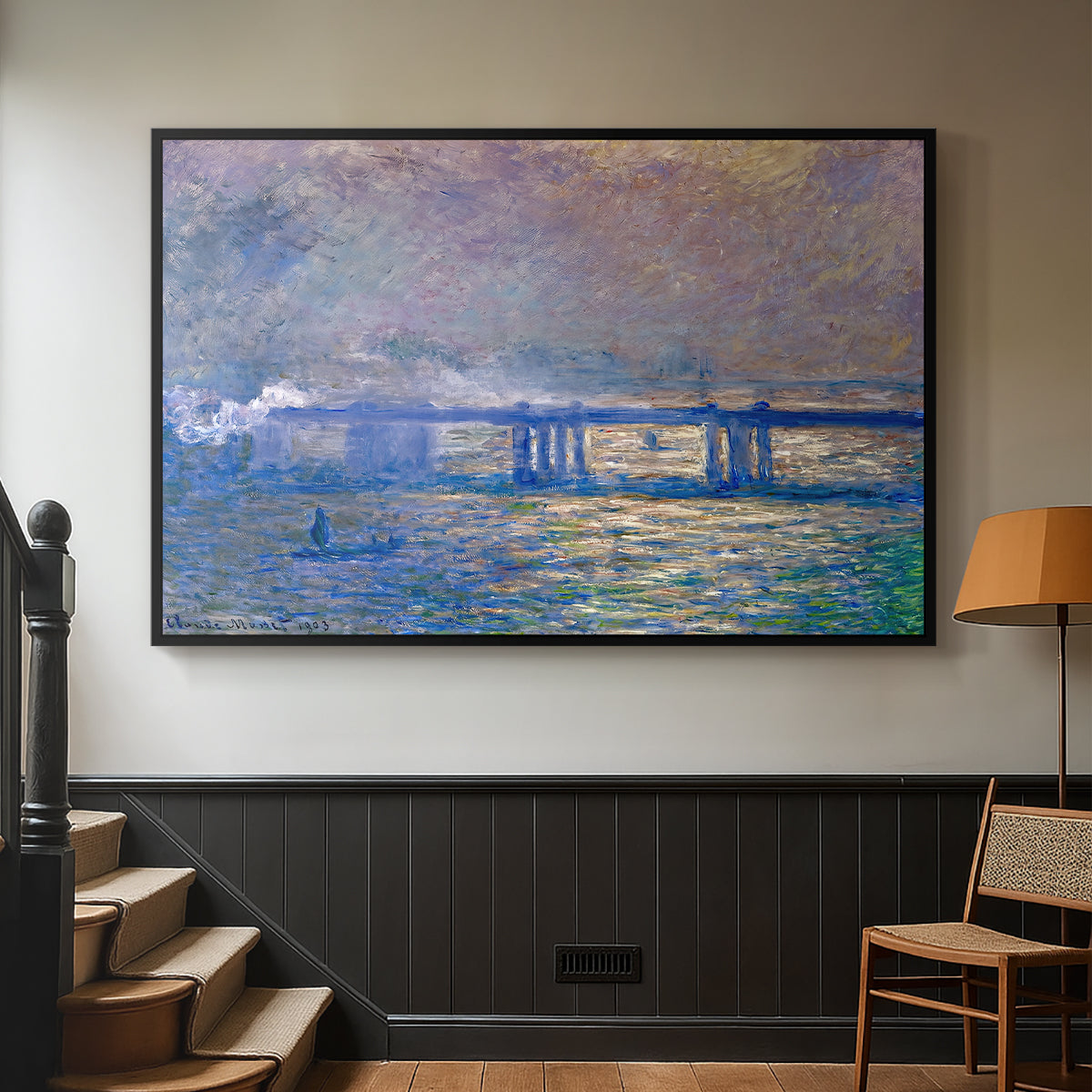 Black floater framed canvas featuring a city bridge scene softened by mist and impressionist brushwork, displayed in a hallway near a staircase.