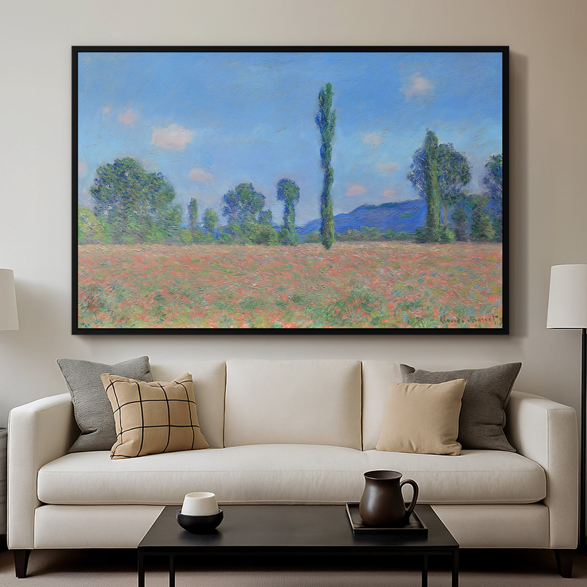 Poppy Field (Giverny), 1890-1891 by Claude Monet displayed in a black floater framed canvas above a sofa in a clean living room.