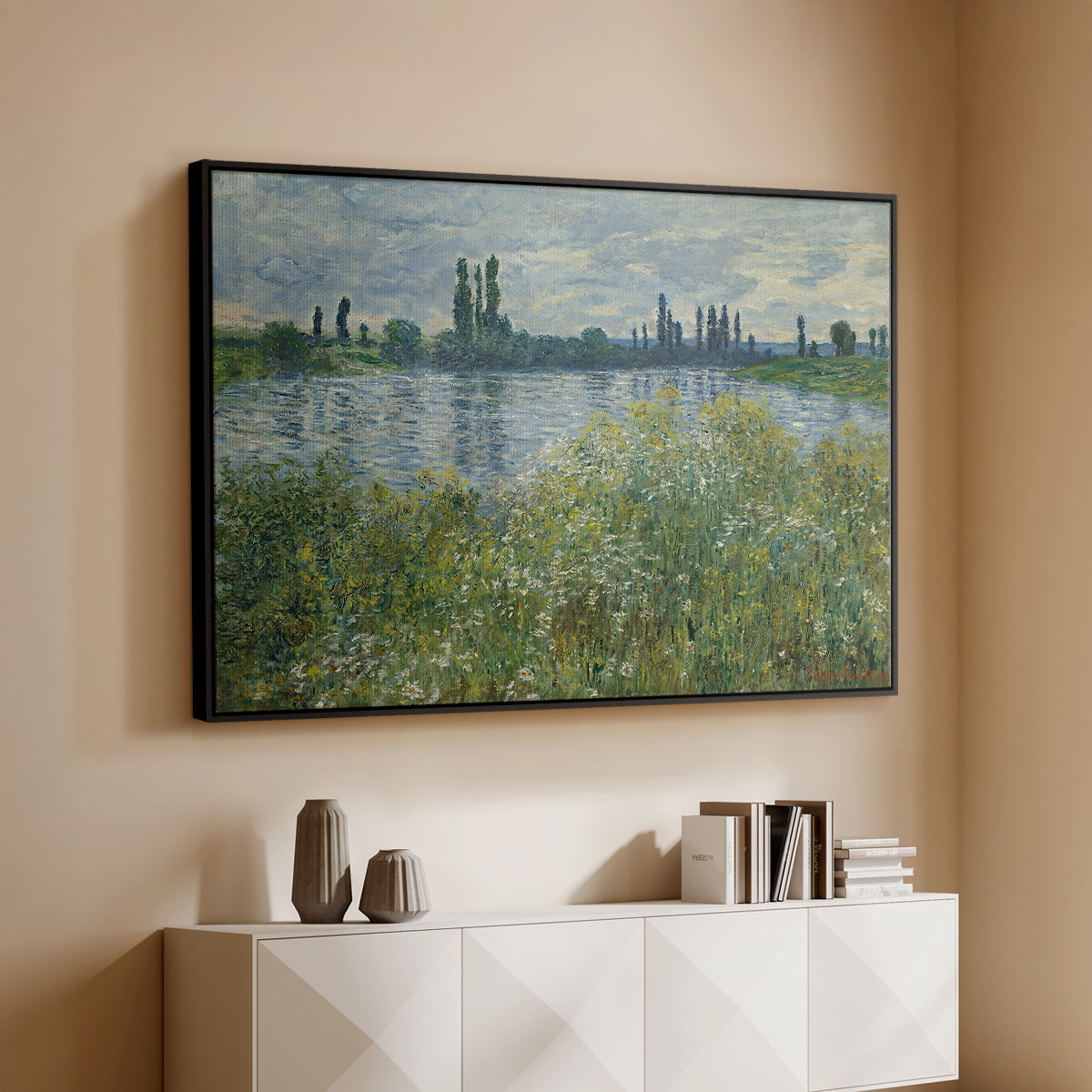 Black floater framed canvas of Banks of the Seine, Vétheuil, 1880 by Claude Monet, featuring an impressionist view of Seine with reflections and greenery above a console cabinet in a minimalist entryway.