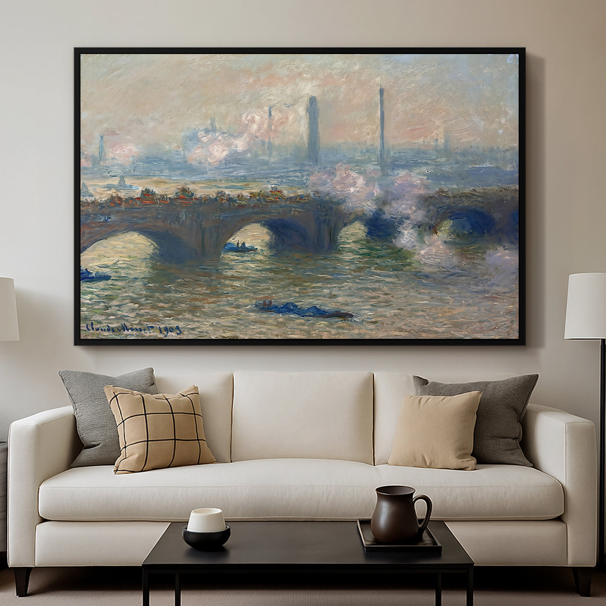 Waterloo Bridge, Gray Day, 1903 by Claude Monet displayed in a black floater framed canvas above a sofa in a clean living room.