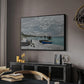 The Beach at Sainte-Adresse, 1867 by Claude Monet in a black floater framed canvas featuring a coastal landscape with sailboats and visitors on cliffside, displayed above a desk in a dark home office interior.