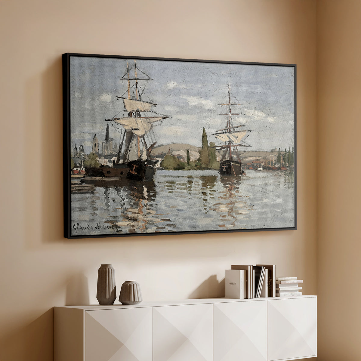 Black floater framed canvas of Ships Riding on the Seine at Rouen, 1872 by Claude Monet, featuring an impressionist river scene with anchored sailing ships and reflections above a console cabinet in a minimalist entryway.