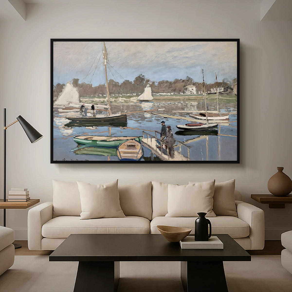 The Basin at Argenteuil, 1874 by Claude Monet as a black floater framed canvas featuring sailboats gathered in calm basin with reflections on water, displayed above a sofa in a modern living room.