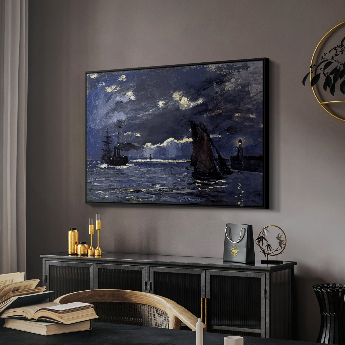 A Seascape, Shipping by Moonlight, 1864 by Claude Monet in a black floater framed canvas featuring a dramatic ocean scene with light reflecting across water at night, displayed above a desk in a dark home office interior.