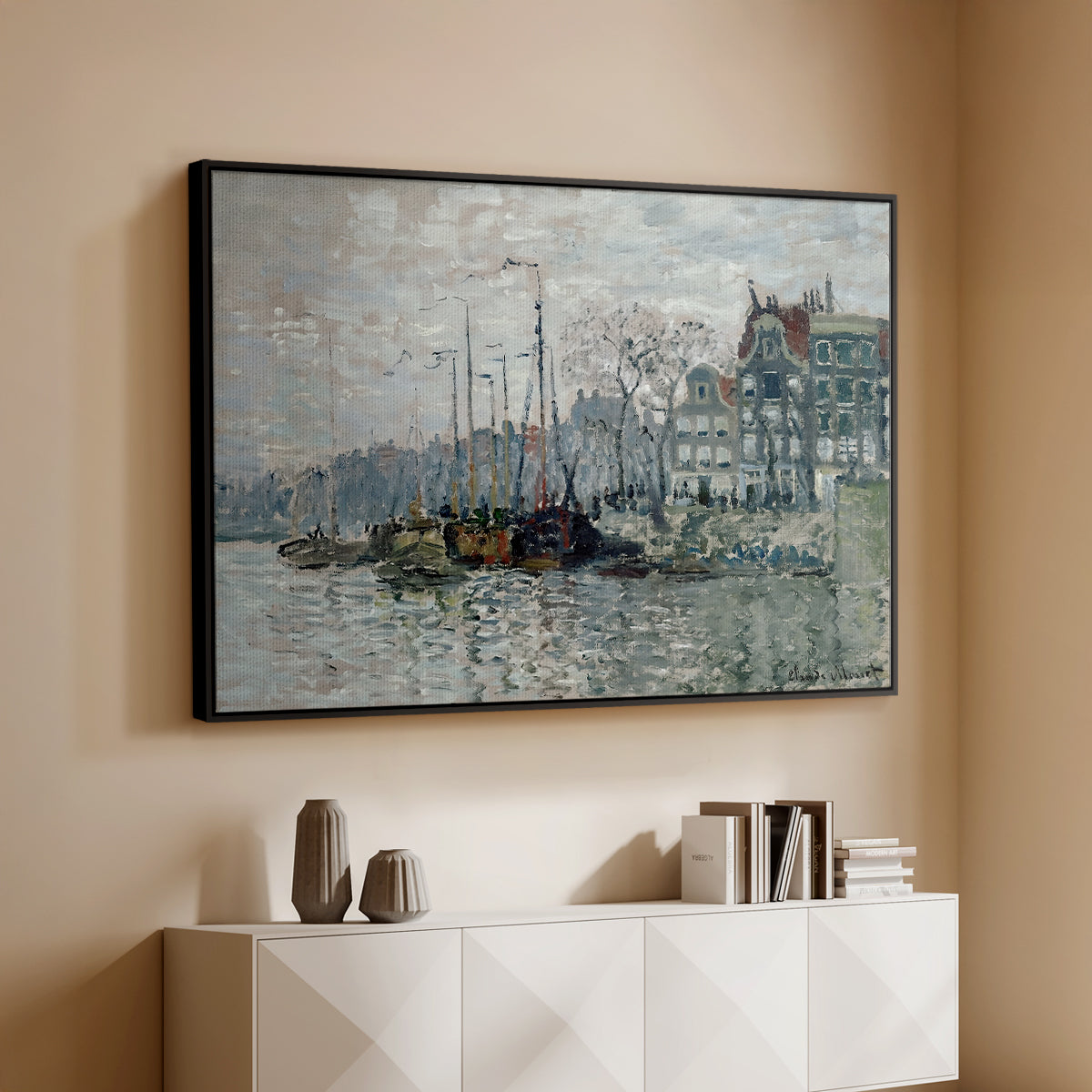 Black floater framed canvas of View of the Prins Hendrikkade and Kromme Waal in Amsterdam, 1874 by Claude Monet, featuring an impressionist cityscape of canal with ships and architecture above a console cabinet in a minimalist entryway.