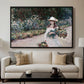Young Girl in the Garden at Giverny, 1888 by Claude Monet displayed in a black floater framed canvas above a sofa in a clean living room.