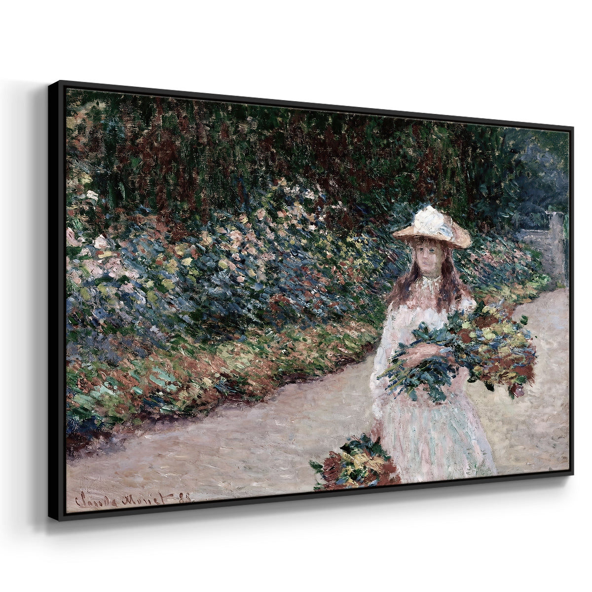 Angled view of Young Girl in the Garden at Giverny, 1888 by Claude Monet in a black floater framed canvas.