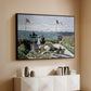 Black floater framed canvas of Garden at Sainte-Adresse, 1867 by Claude Monet, featuring an impressionist coastal garden with people and ocean view above a console cabinet in a minimalist entryway.