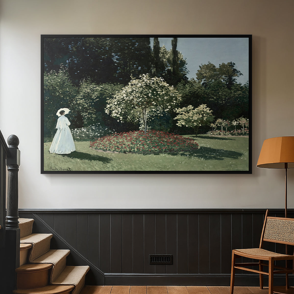 Black floater framed canvas featuring a tranquil garden portrait with soft natural light, displayed in a hallway near a staircase.