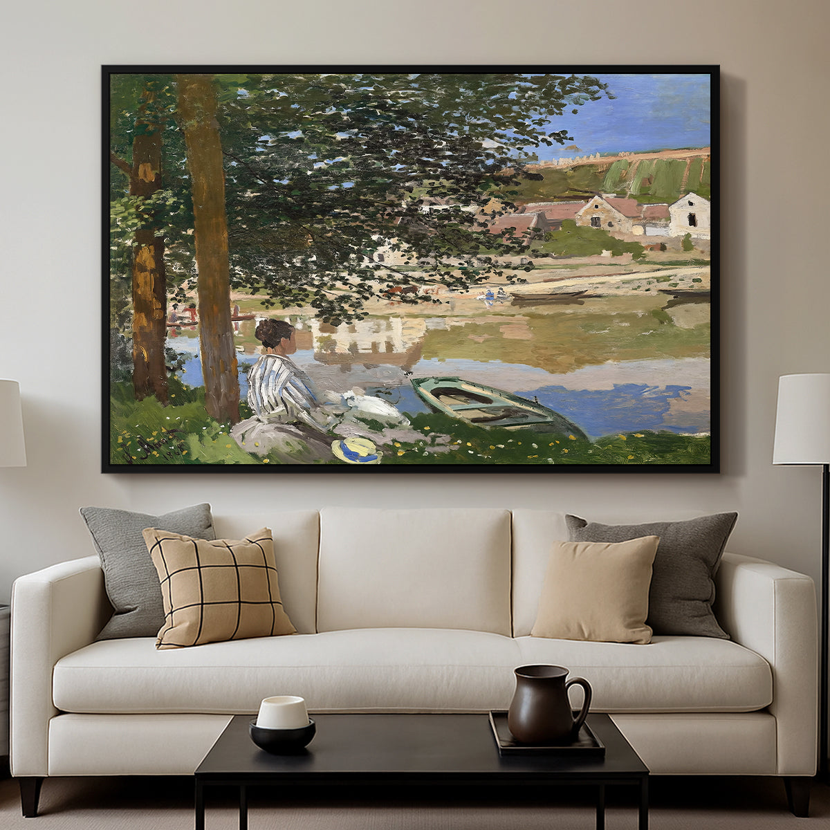 On the Bank of the Seine, Bennecourt, 1868 by Claude Monet displayed in a black floater framed canvas above a sofa in a clean living room.