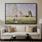 Summer (L'ete), 1874 by Claude Monet displayed in a black floater framed canvas above a sofa in a clean living room.