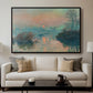 Sunset on the Seine at Lavacourt, Winter Effect, 1880 by Claude Monet displayed in a black floater framed canvas above a sofa in a clean living room.