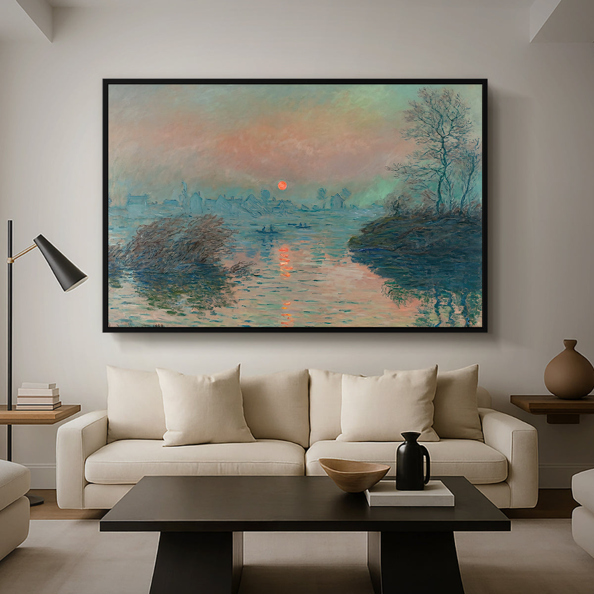 Sunset on the Seine at Lavacourt, Winter Effect, 1880 by Claude Monet as a black floater framed canvas featuring a glowing sunset over snowy river landscape with soft reflections, displayed above a sofa in a modern living room.