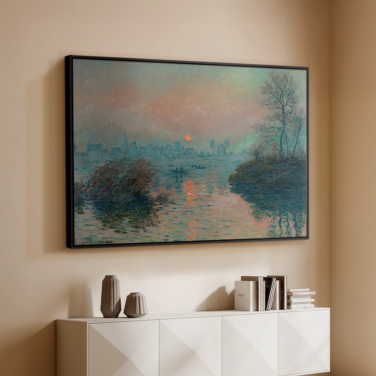 Black floater framed canvas of Sunset on the Seine at Lavacourt, Winter Effect, 1880 by Claude Monet, featuring a winter scene with warm light reflecting on water at dusk above a console cabinet in a minimalist entryway.