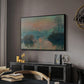Sunset on the Seine at Lavacourt, Winter Effect, 1880 by Claude Monet in a black floater framed canvas featuring an impressionist view of river at sunset with snowy banks, displayed above a desk in a dark home office interior.