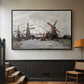 Black floater framed canvas featuring a landscape featuring windmills and low horizon sky, displayed in a hallway near a staircase.