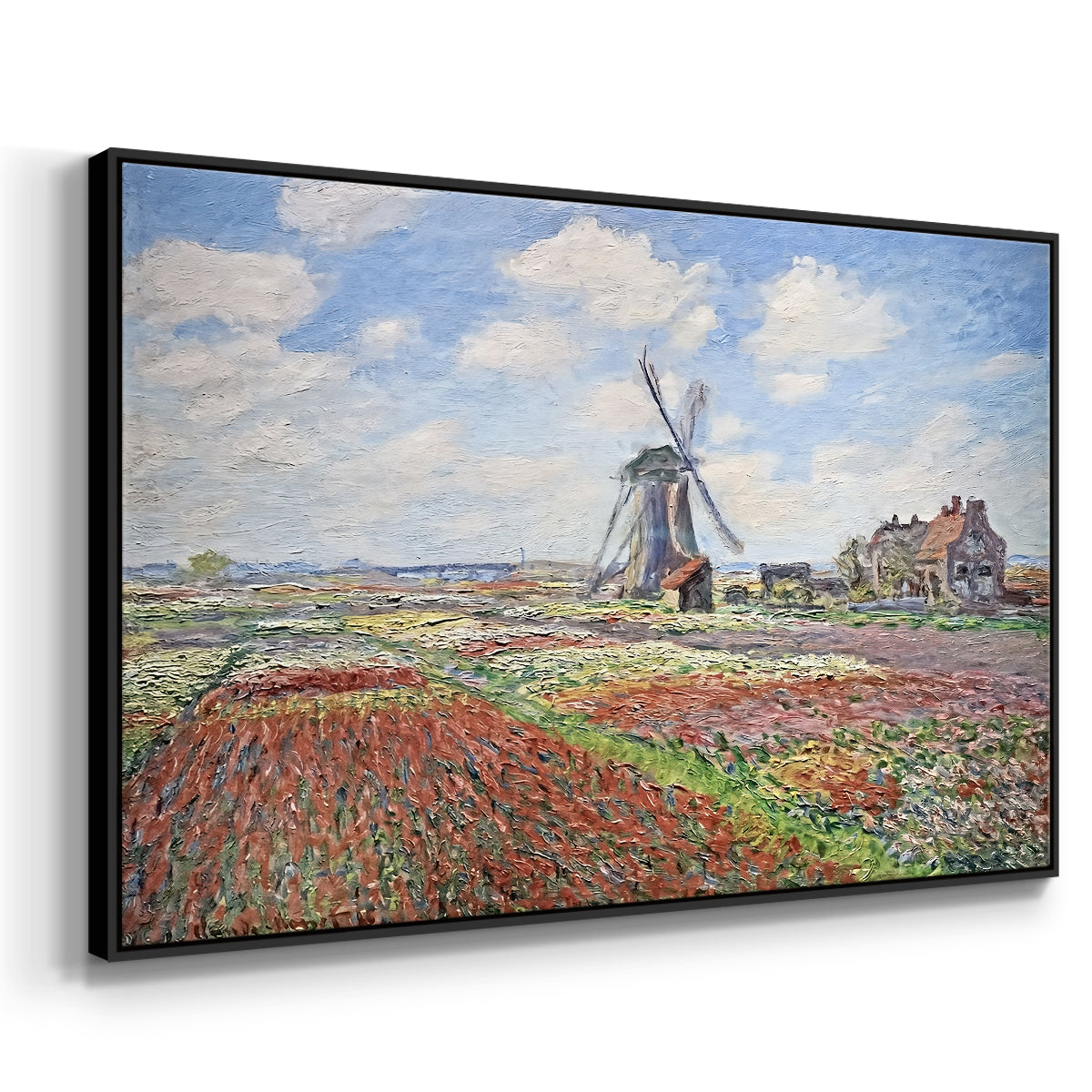 Angled view of Tulip Fields with the Rijnsburg Windmill, 1886 by Claude Monet in a black floater framed canvas.