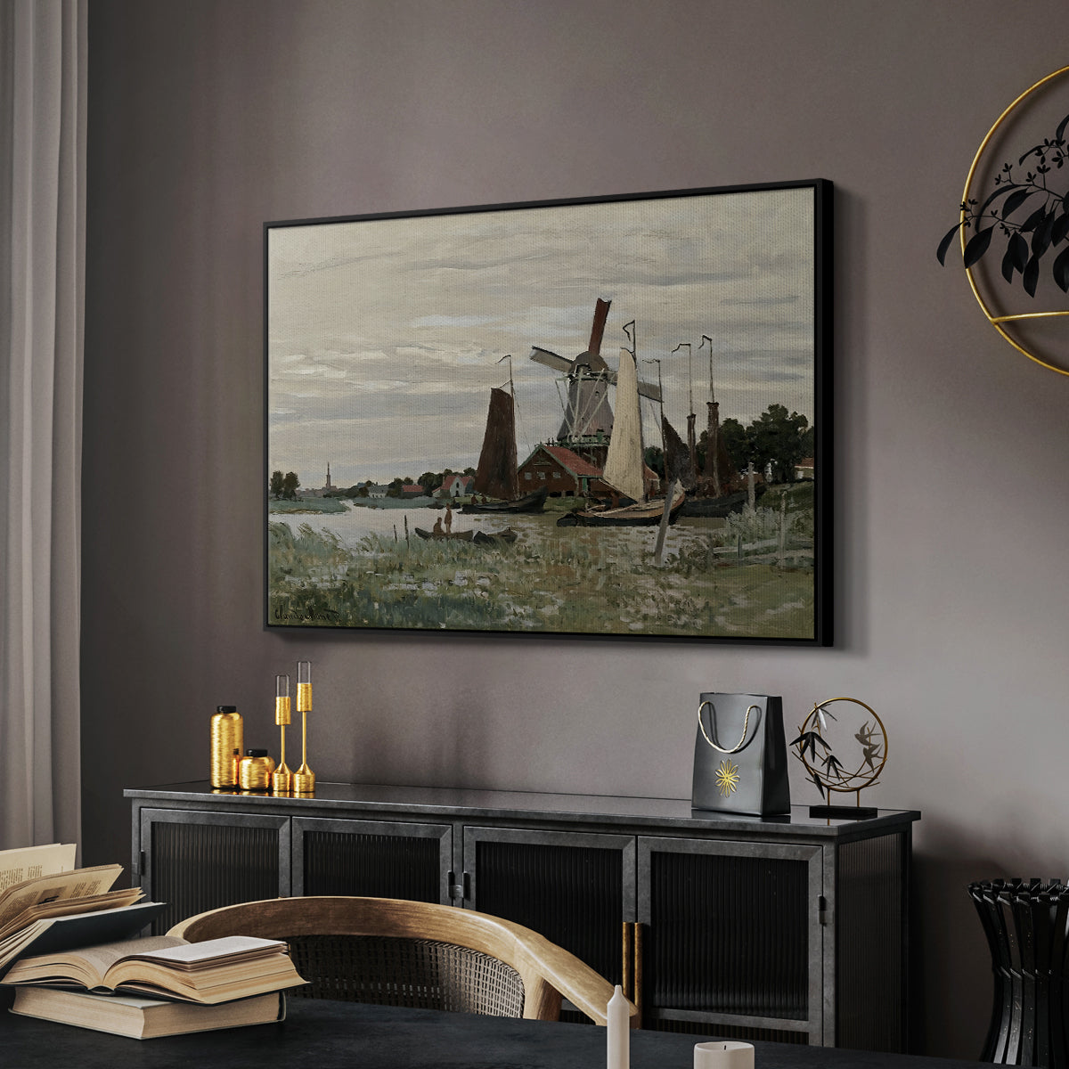 Windmill at Zaandam, 1871 by Claude Monet in a black floater framed canvas featuring a rustic scene with windmill and reflections in water, displayed above a desk in a dark home office interior.