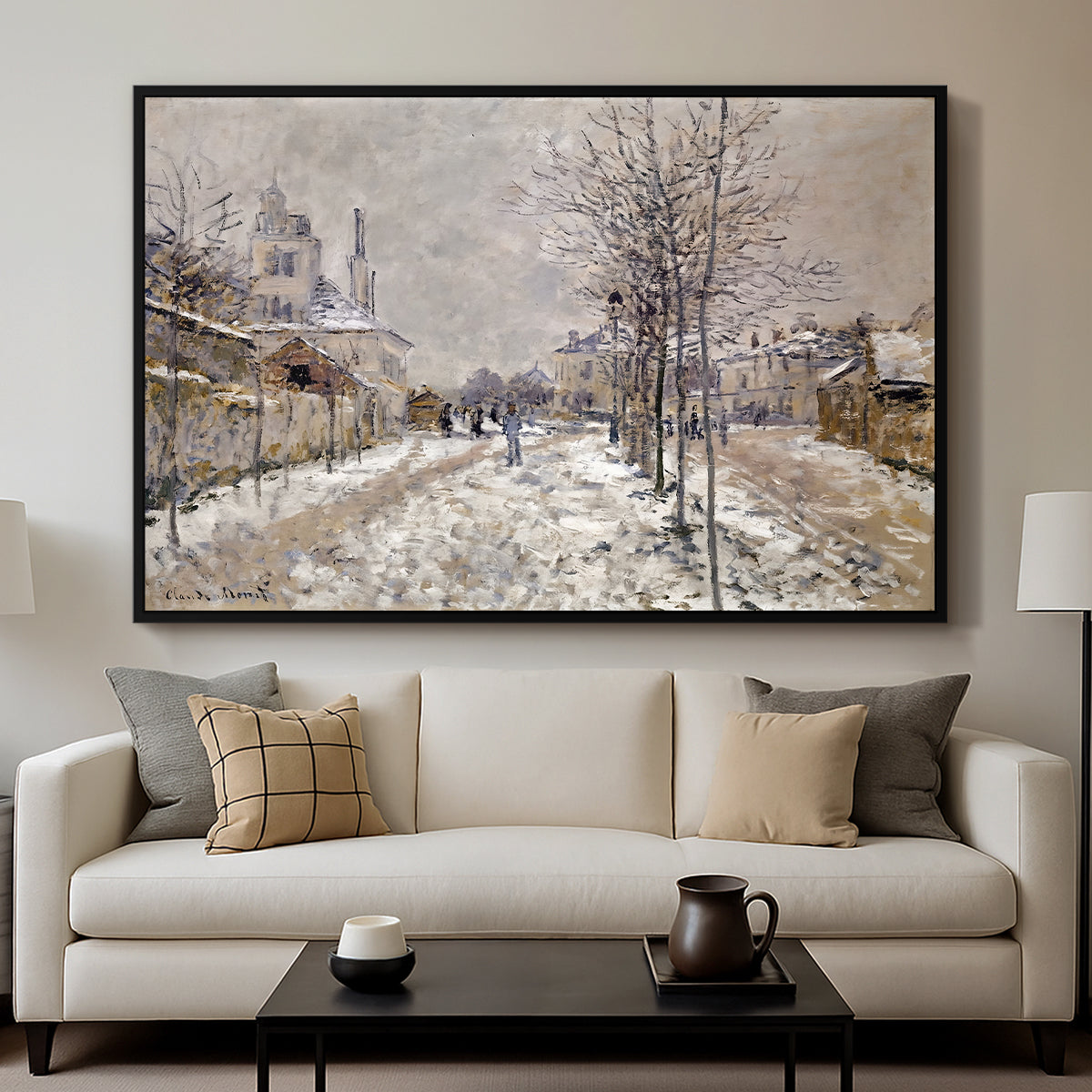 The Boulevard de Pontoise at Argenteuil, Snow Effect, 1875 by Claude Monet displayed in a black floater framed canvas above a sofa in a clean living room.
